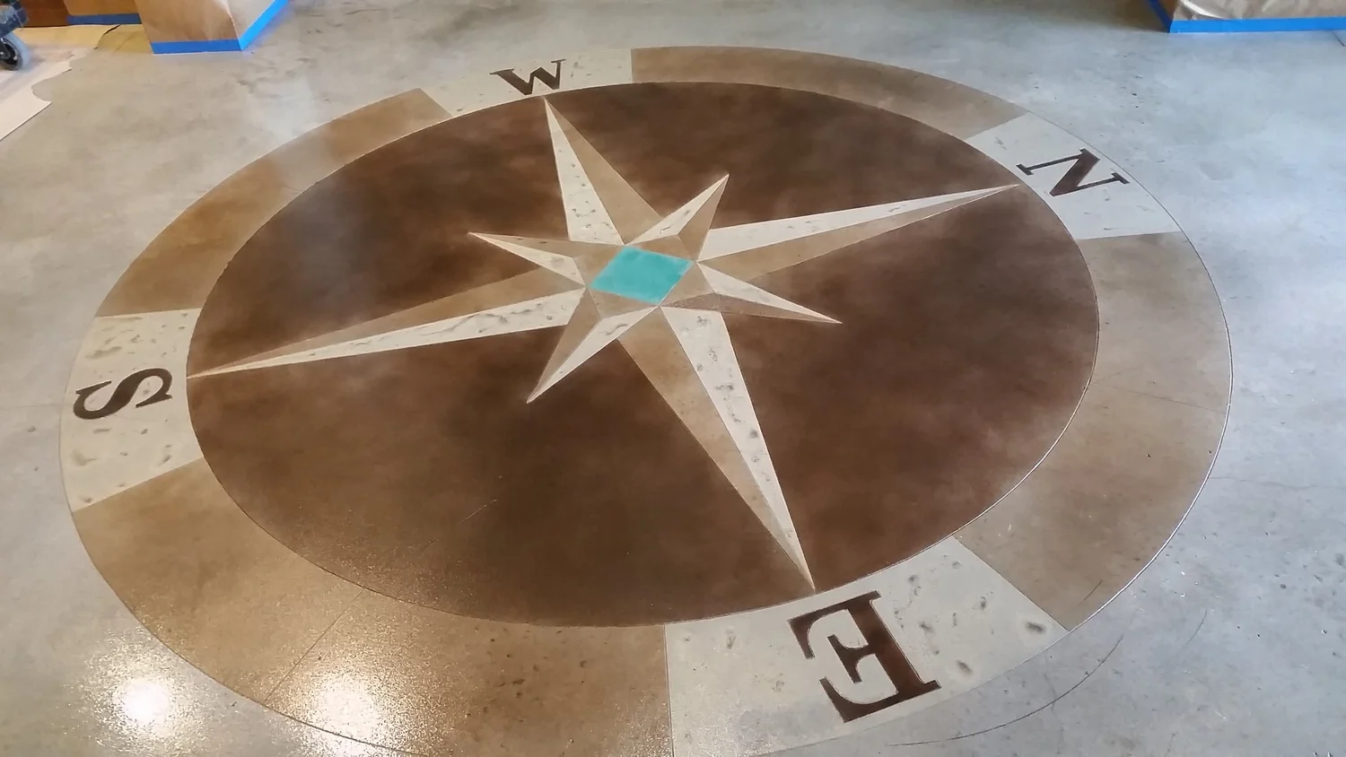 Circular compass floor design at a camp facility